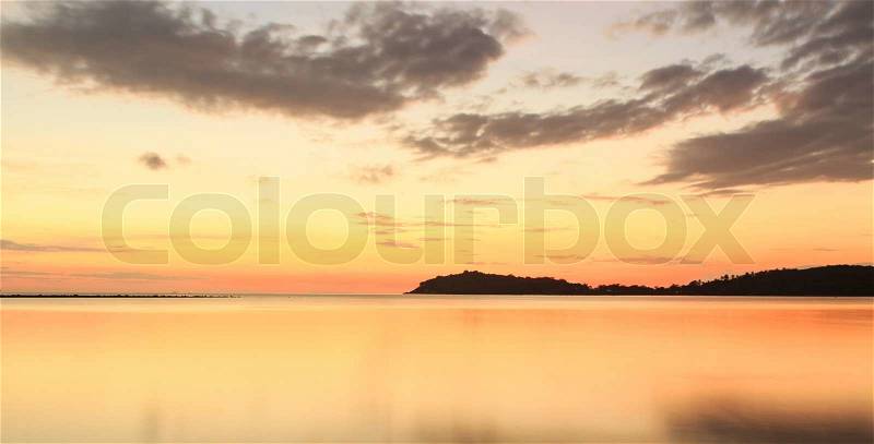 Sun rising over the tropical sea,long exposure, stock photo