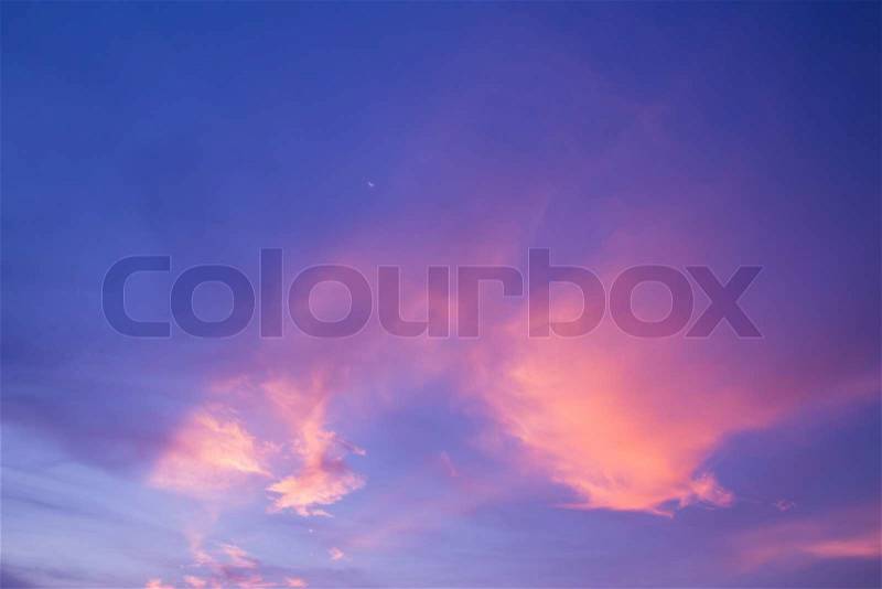 Half moon,pink cloud and blue sky at dusk, stock photo