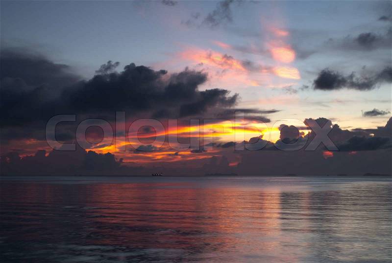 Fire sunset over ocean, stock photo