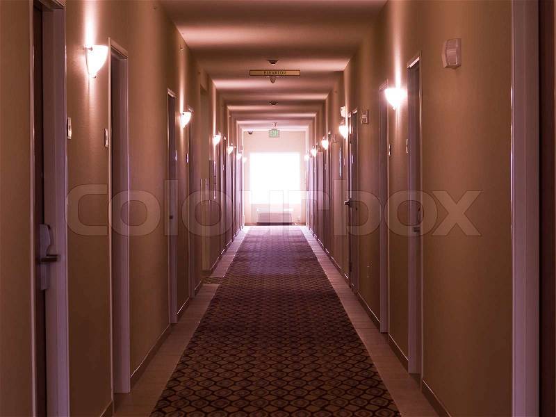 Empty hotel corridor in monochrome pink color tone, stock photo