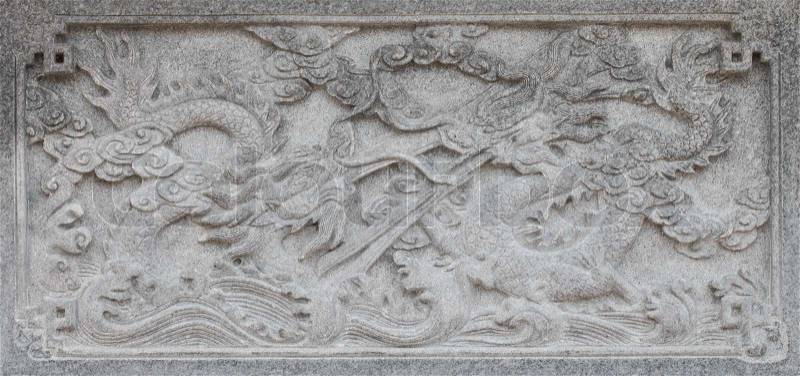 Two dragons on carve wall, stock photo