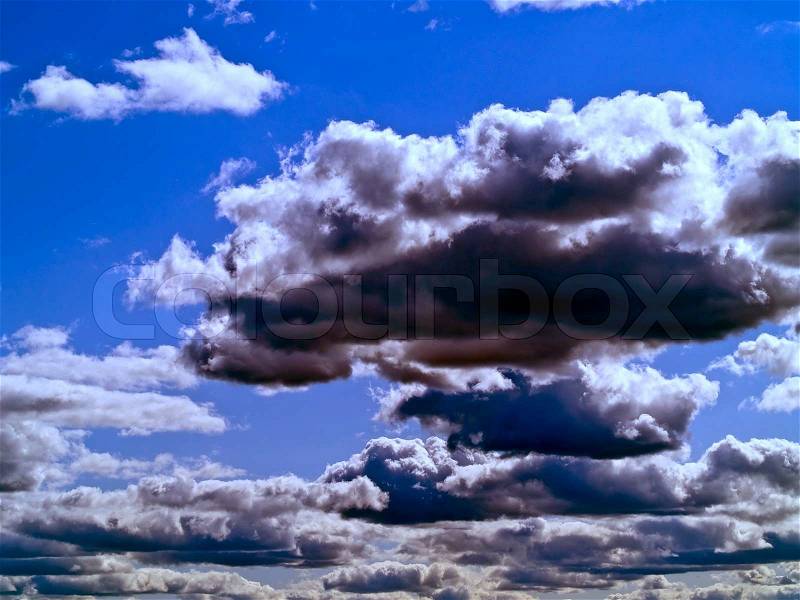 Gray Clouds on a Blue Sky, stock photo