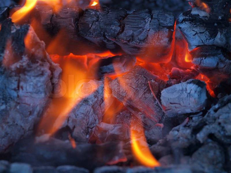 Background of Flames and Glowing Embers in a Campfire, stock photo