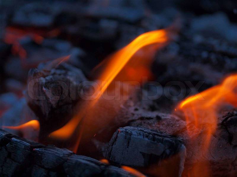 Background of Flames and Glowing Embers in a Campfire, stock photo