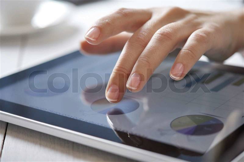 Finger touching screen on touchpad, stock photo
