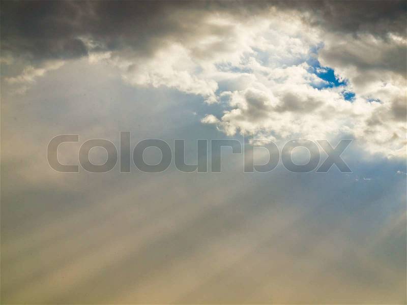 Dramatic Cloudscape with Sunbeams Streaming through the Clouds, stock photo