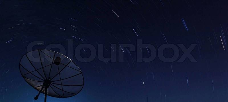 Conceptual of Big Black satellite over spiral star at night, stock photo