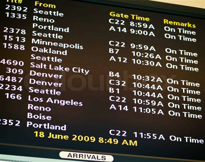Electronic airport schedule board for a mid-sized American airport, stock photo