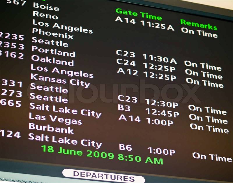 Electronic airport schedule board for a mid-sized American airport, stock photo