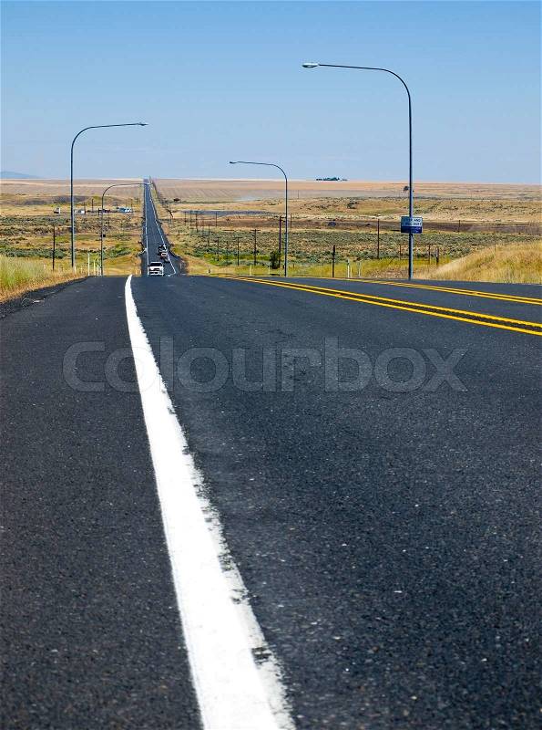 Straight Line Highway in the Country on a Clear Sunny Day, stock photo