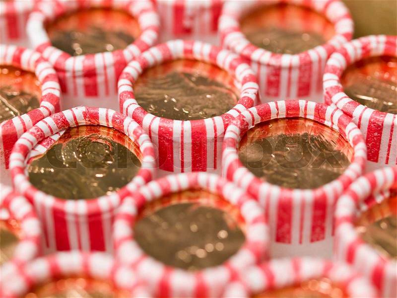 Penny Rolls Lined Up in a Box of Coins, stock photo