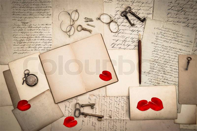 Open book, antique accessories, old love letters, stock photo