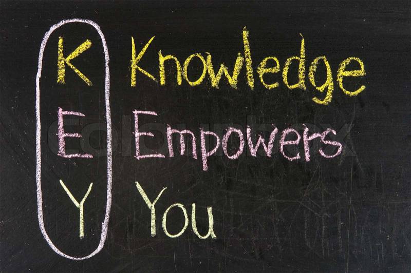 KEY acronym - Knowledge empowers you on a blackboard with words written in chalk, stock photo