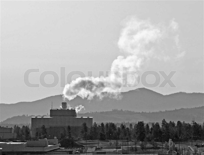Waste to Energy Plant with Smoke Coming Out of a Smokestack in Black and White, stock photo