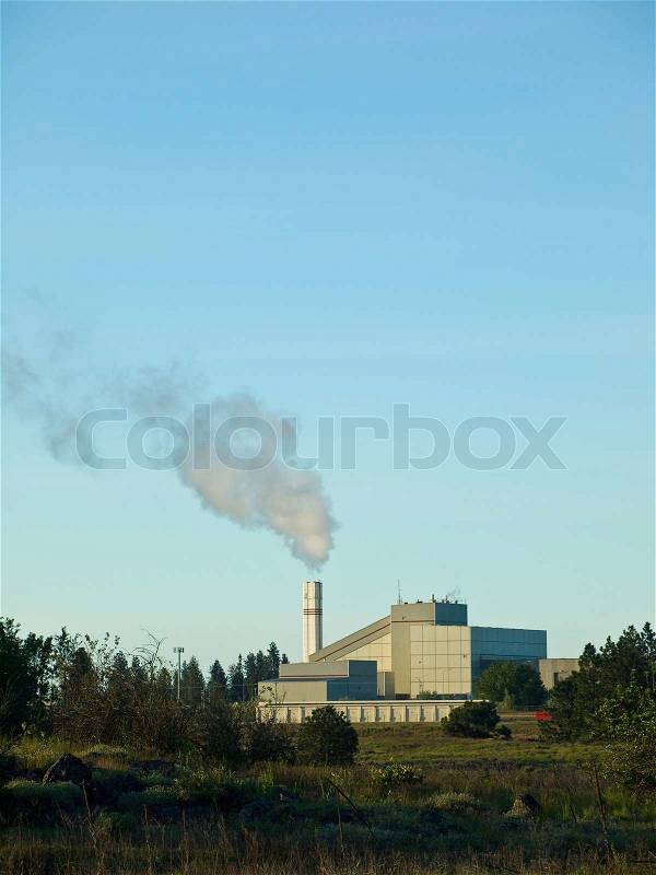 Waste to Energy Plant with Smoke Coming Out of a Smokestack, stock photo