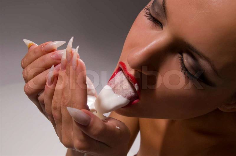 Woman eats sour, stock photo