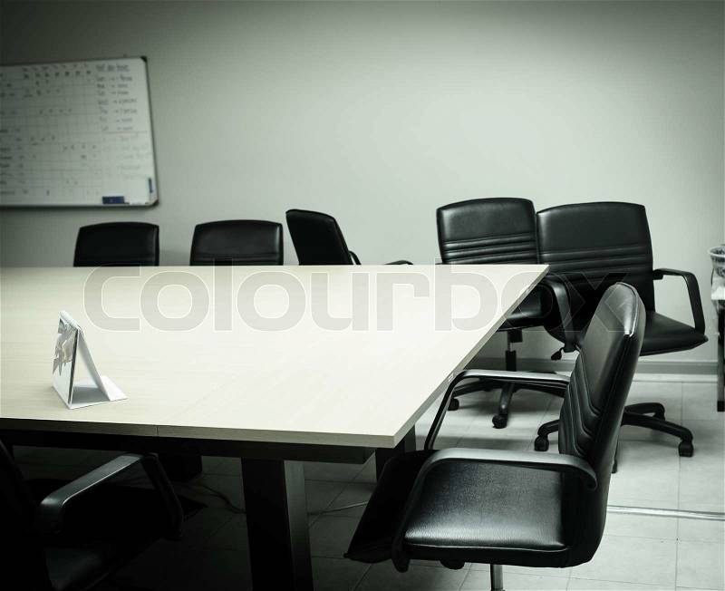 An empty meeting room and conference table, from mirror ...