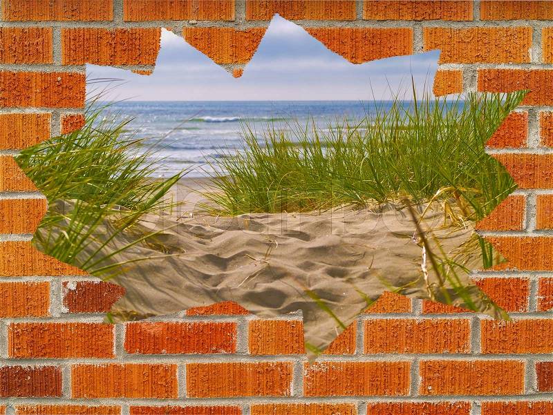 Sandy Path with Beach Grass Behind a Hole in a Brick Wall, stock photo