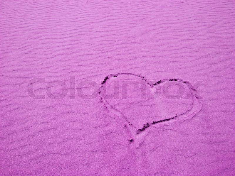 Purple Heart in the Sand on a Sunny Day, stock photo