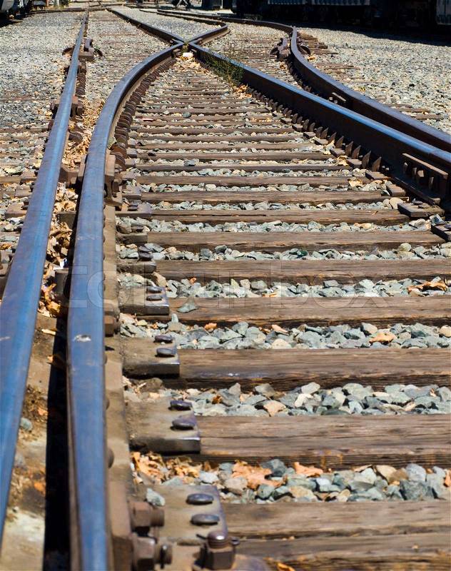 Old Railroad Tracks at a Junction on a Sunny Day, stock photo