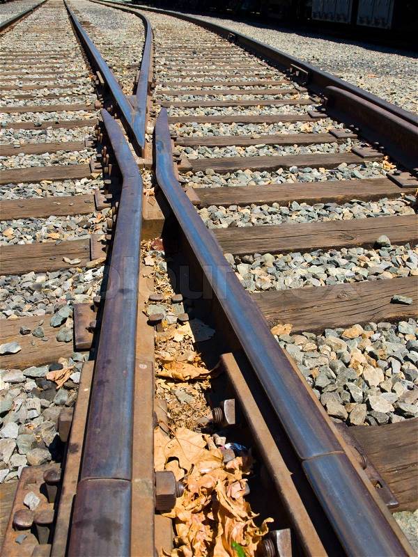 Old Railroad Tracks at a Junction on a Sunny Day, stock photo