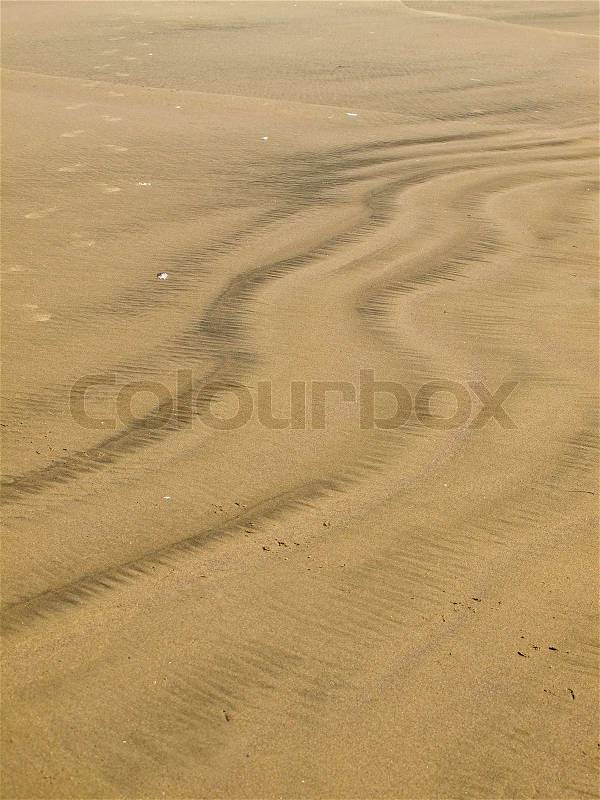 Colored Sand Patterns Created by Waves and Wind, stock photo