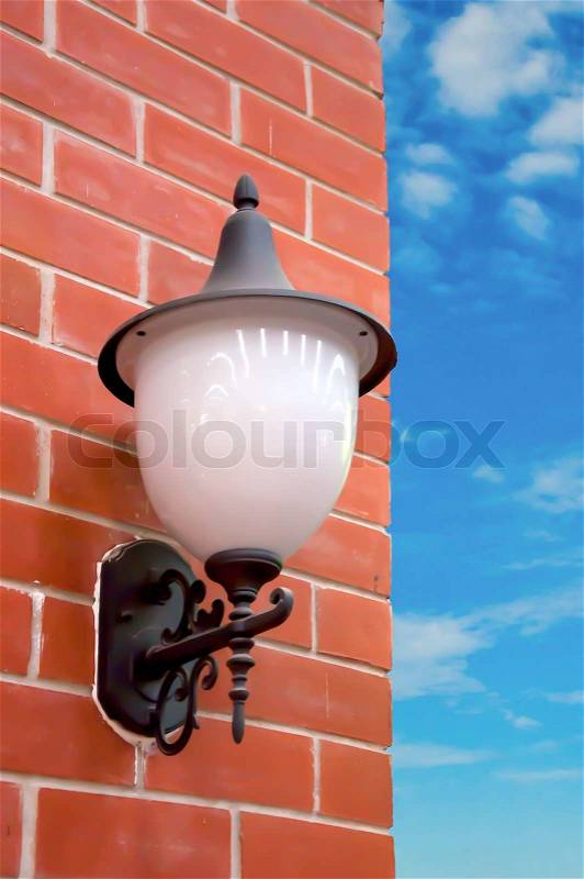 Old street lamp on the wall, stock photo