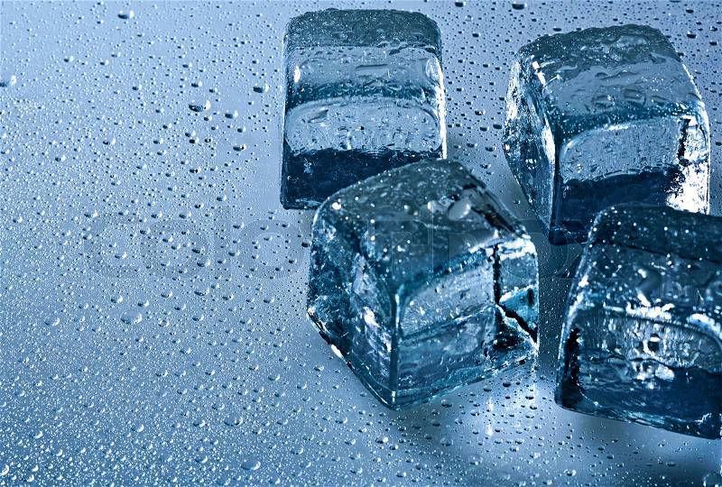 Ice cube and water drops on the wet background, stock photo