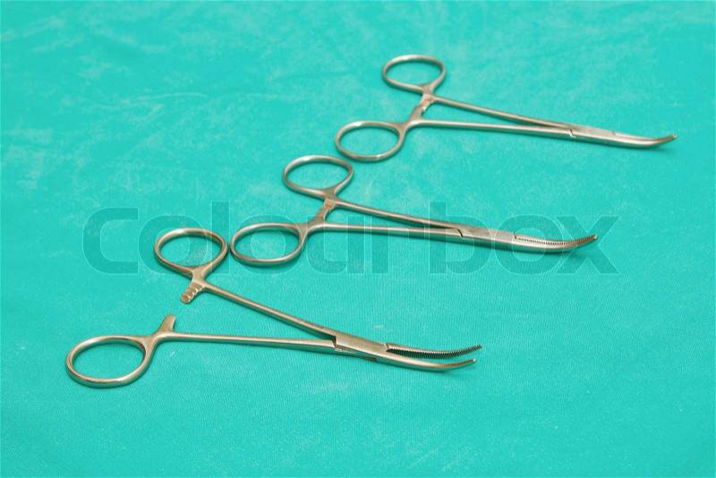 Medical instrument forceps on sterile table, stock photo