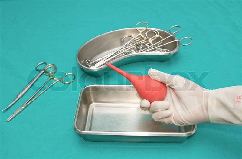 Set of dressing woundinstrument on sterile table with a hand of doctor grabbing a tool, stock photo