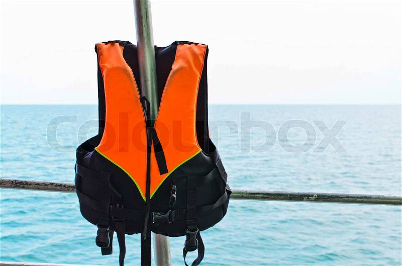 Orange Life jacket and sea, stock photo