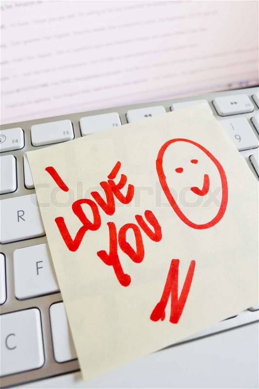 Note on computer keyboard: i love you, stock photo