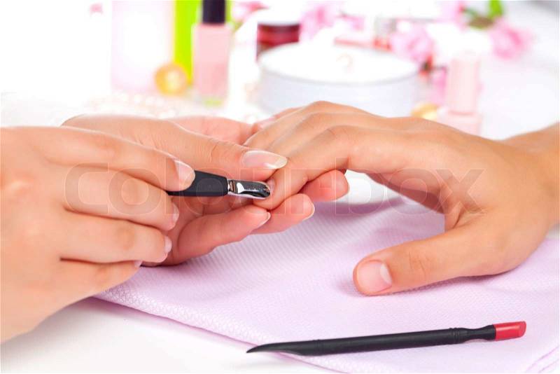 Manicure Care of fingers of hands, cleaning, covering a varnish of nails, stock photo