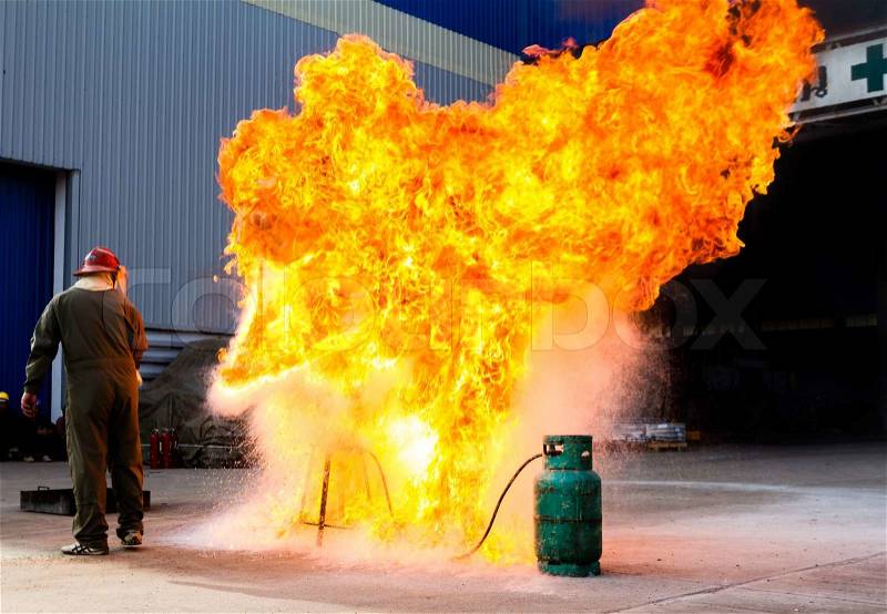 Fire-fighter trains extinguishing a fire, stock photo