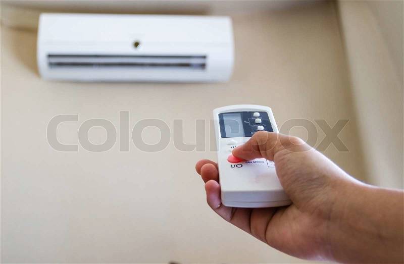 Closeup view about using some appliance such as air condition, stock photo