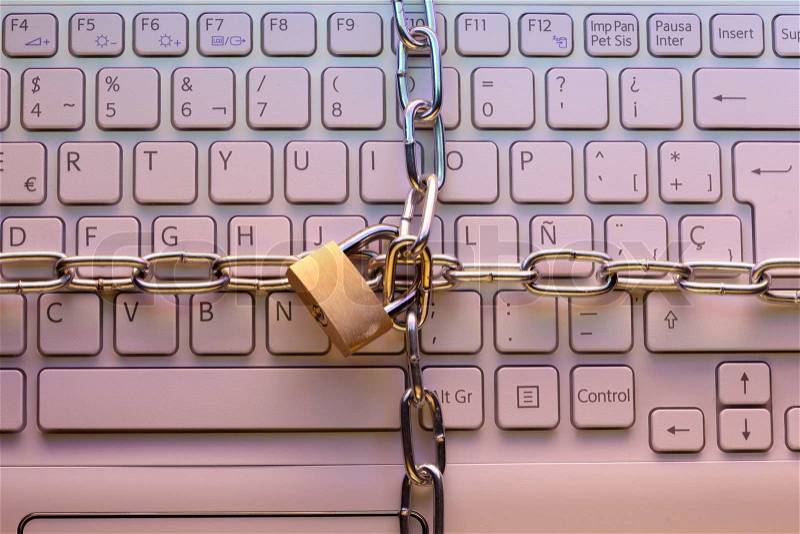 Laptop keyboard locked with a padlock Computer security concept, stock photo