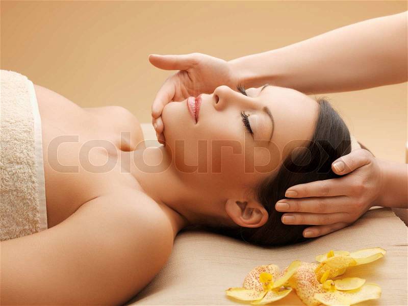Picture of calm beautiful woman in massage salon, stock photo