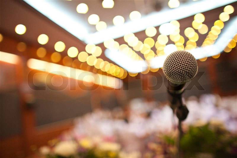 Close up of microphone in concert hall or conference room, stock photo