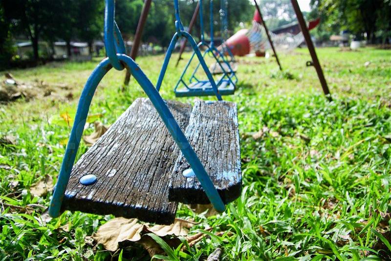 Wood swing on kid garden, stock photo