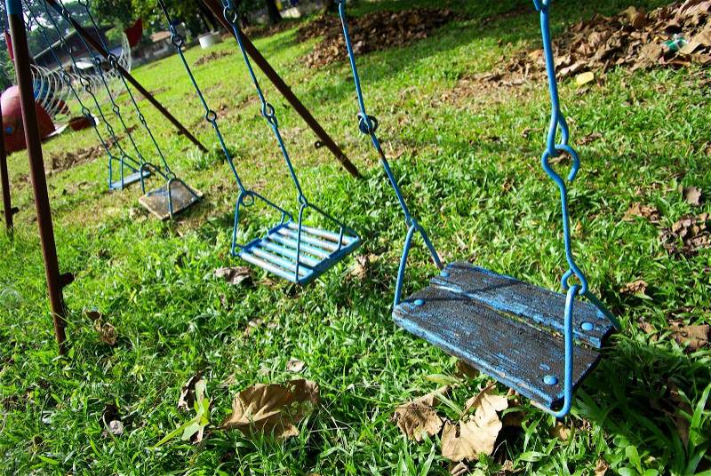 Wood swing on kid garden, stock photo
