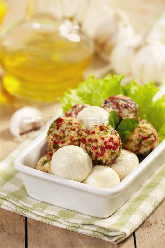 Fresh cheese balls with oil and spices, stock photo