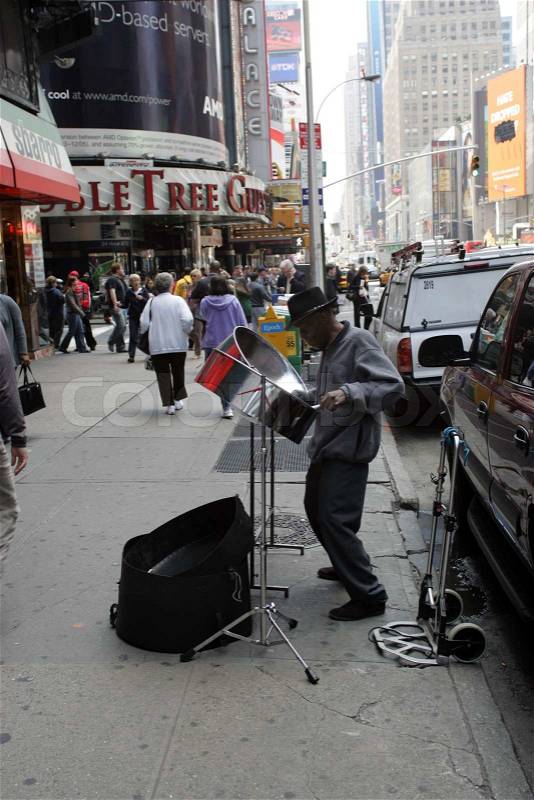 Man playing on the street in New York, stock photo