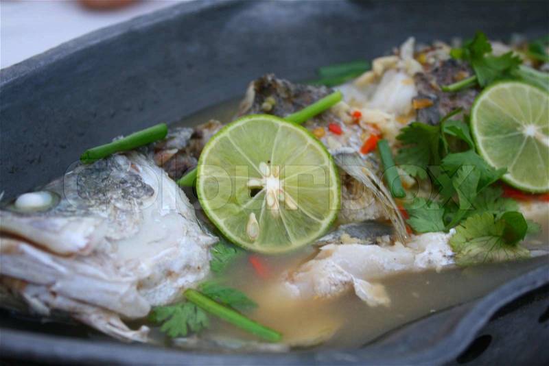 Fish steamed with spicy chili and lemon sauce, stock photo