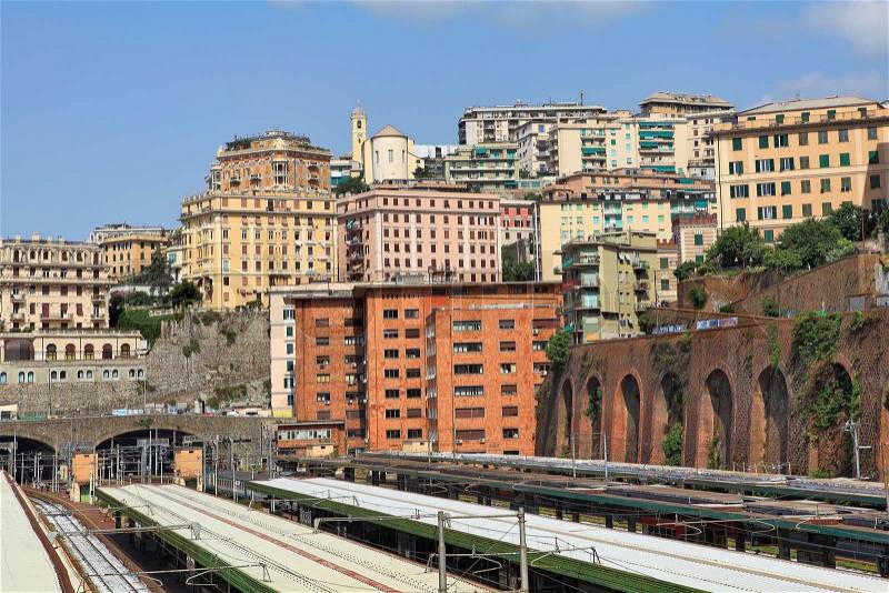 Residential urban buildings above railway central station in city of Genoa, Italy, stock photo