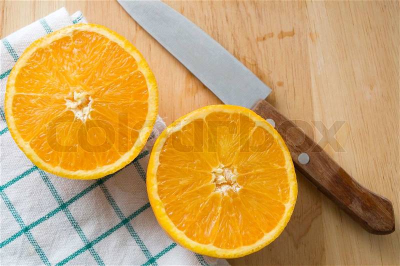 Knife cut of fresh orange, stock photo