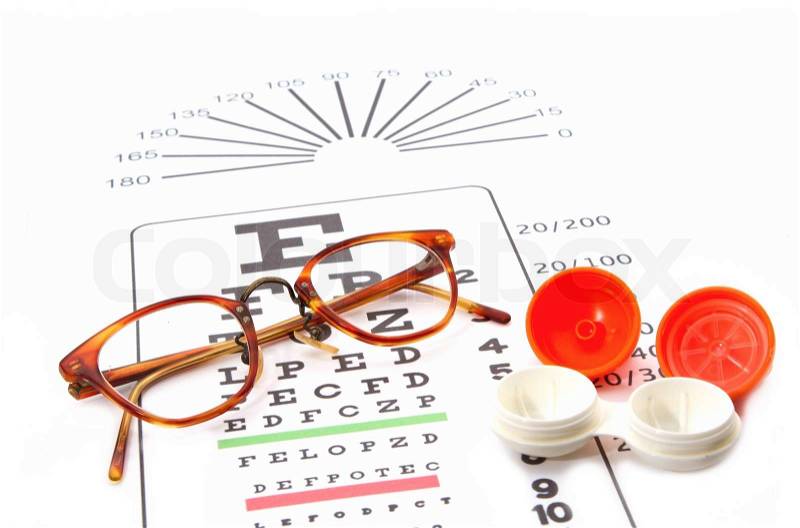 eye test chart and glasses and containers for contact lenses , stock photo
