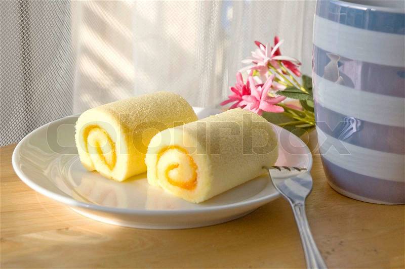 Roll cake set put on table with sunlight at noon, stock photo