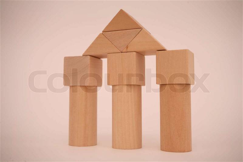 Towers made of wooden building blocks, stock photo