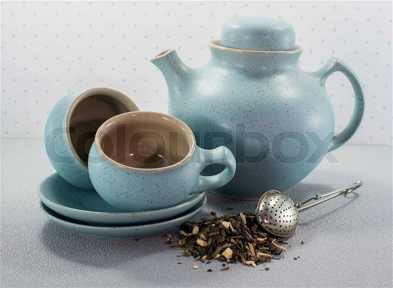 Teacups tea and teapot with teaegg, stock photo