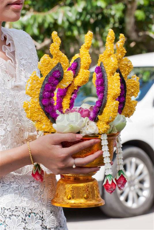 Thai people holding flower for wedding ceremony in Thailand, stock photo